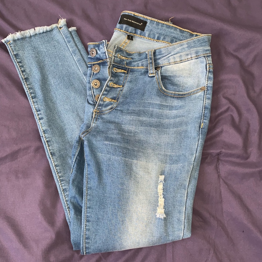 Light distressed blue jeans